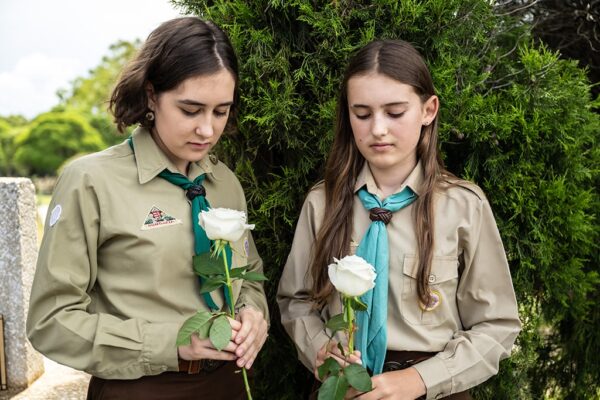grief-care-girl-scouts-remembering-cemetery-white-roses