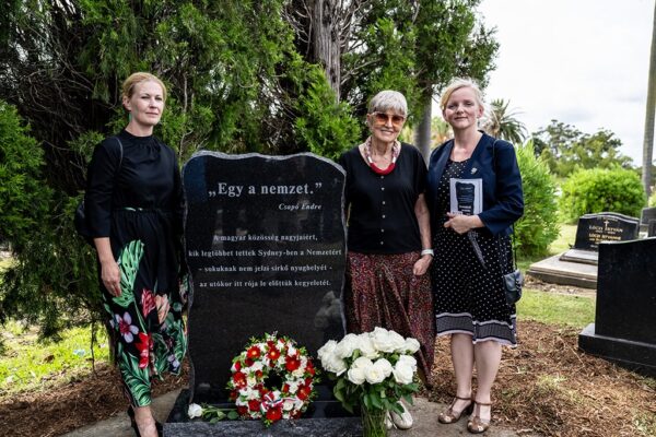grief-care-visitors-standing-at-memorial-headstone